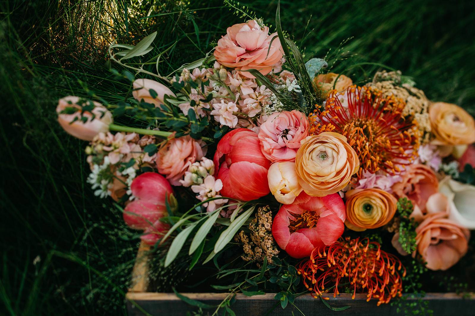 bold bright peach pink orange bridal wedding bouquet flowers floral blooms wisconsin florist madison