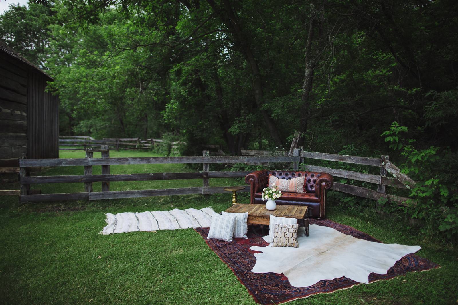 reception lounge area, lounge furniture, rustic vintage lounge furniture, rugs, coffee table, pillow