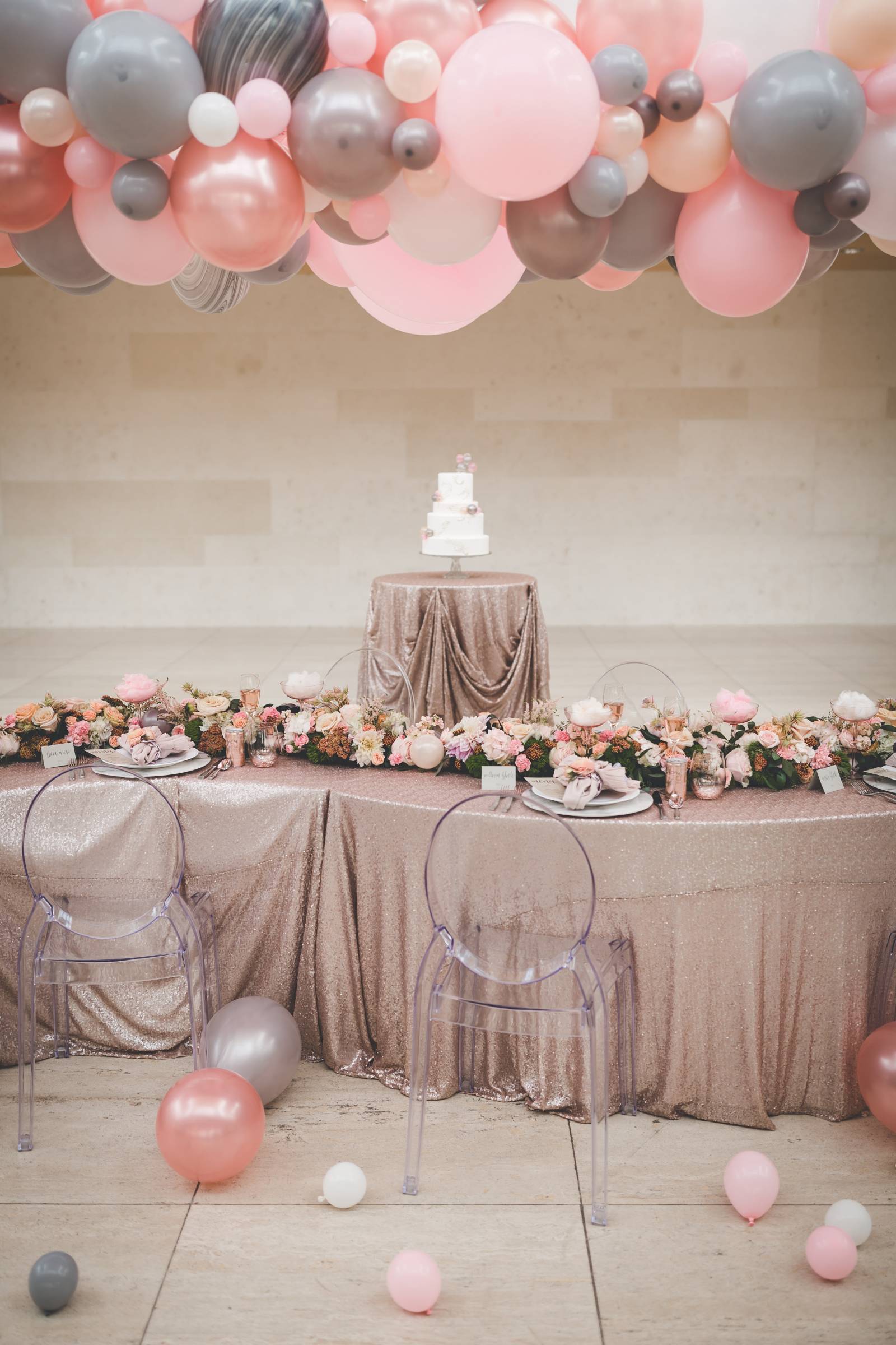 luxe madison wedding inspiration balloon installation ghost chairs