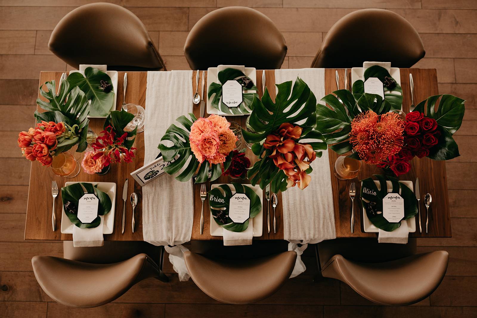 monstera leaf greenery wedding reception tablescape table setting