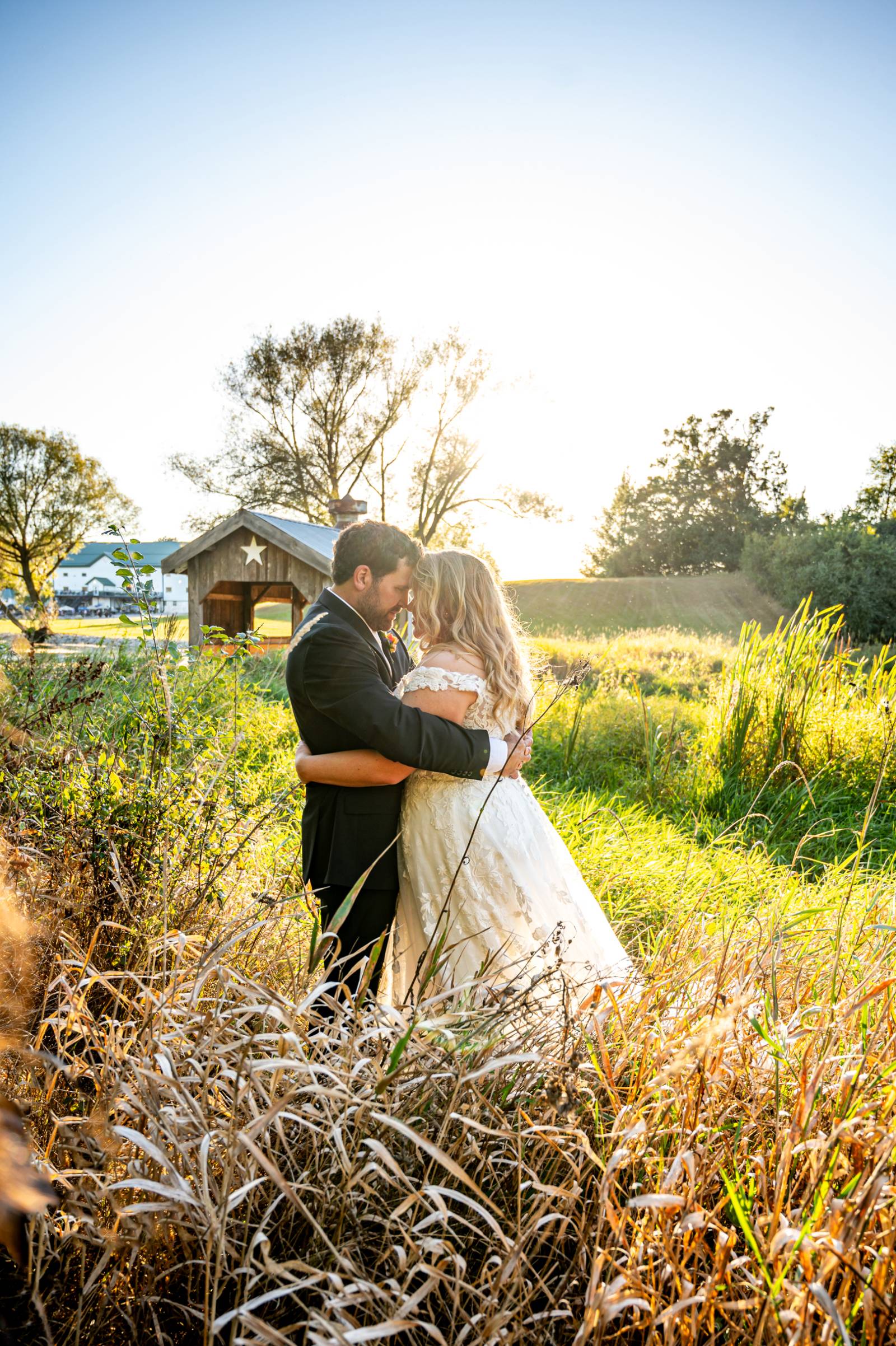 Rustic Charm & Bold Blooms: Sydnie & Derek's Late Summer Wedding at Springbrook Events