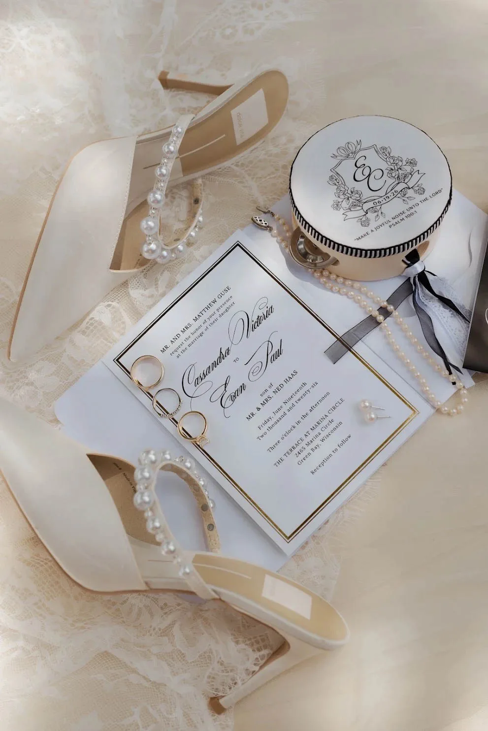 Black and white wedding invitation with monogram wax seal and pearl bridal accessories