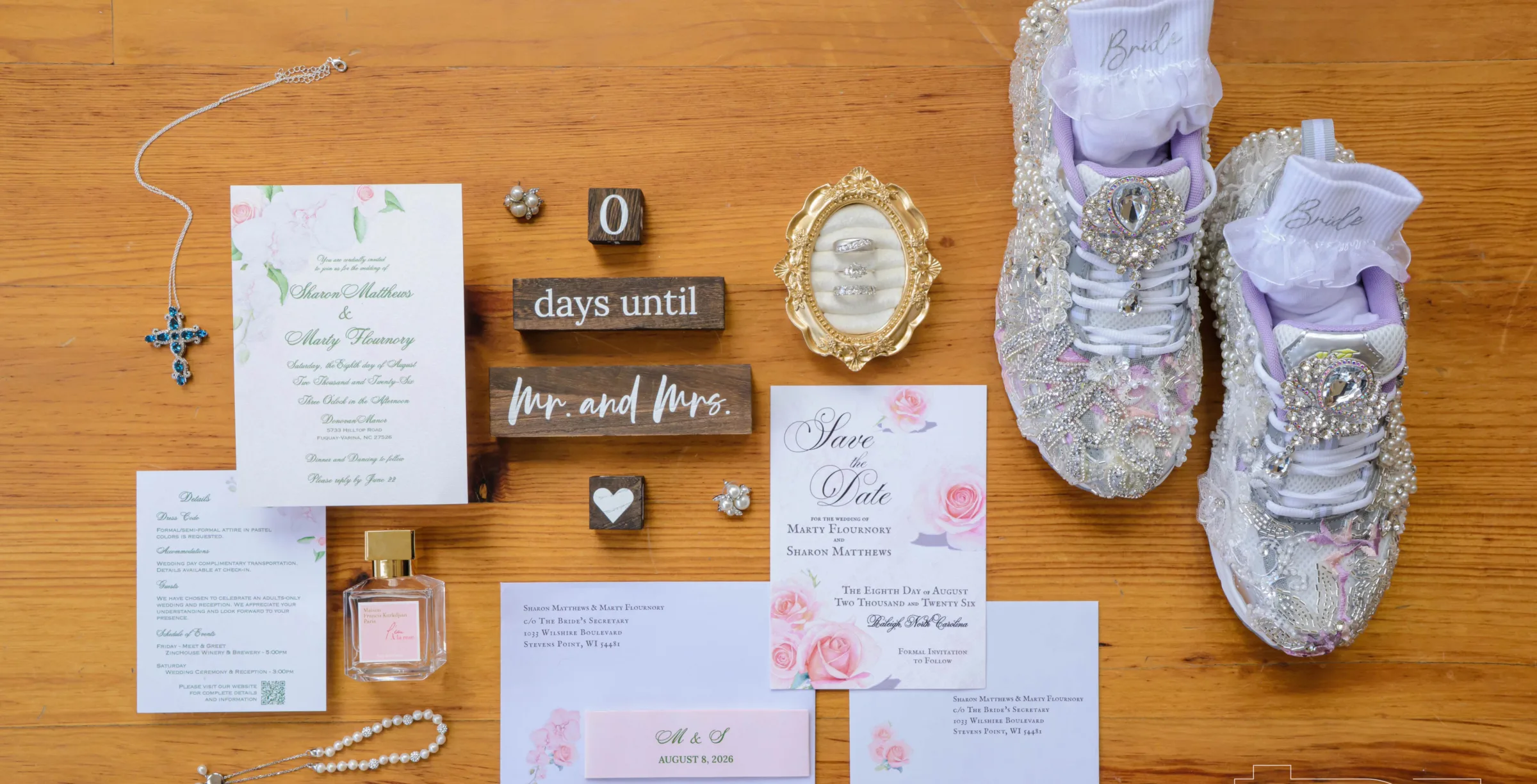 Floral wedding invitation and save-the-date suite styled with rings and bejeweled bridal sneakers