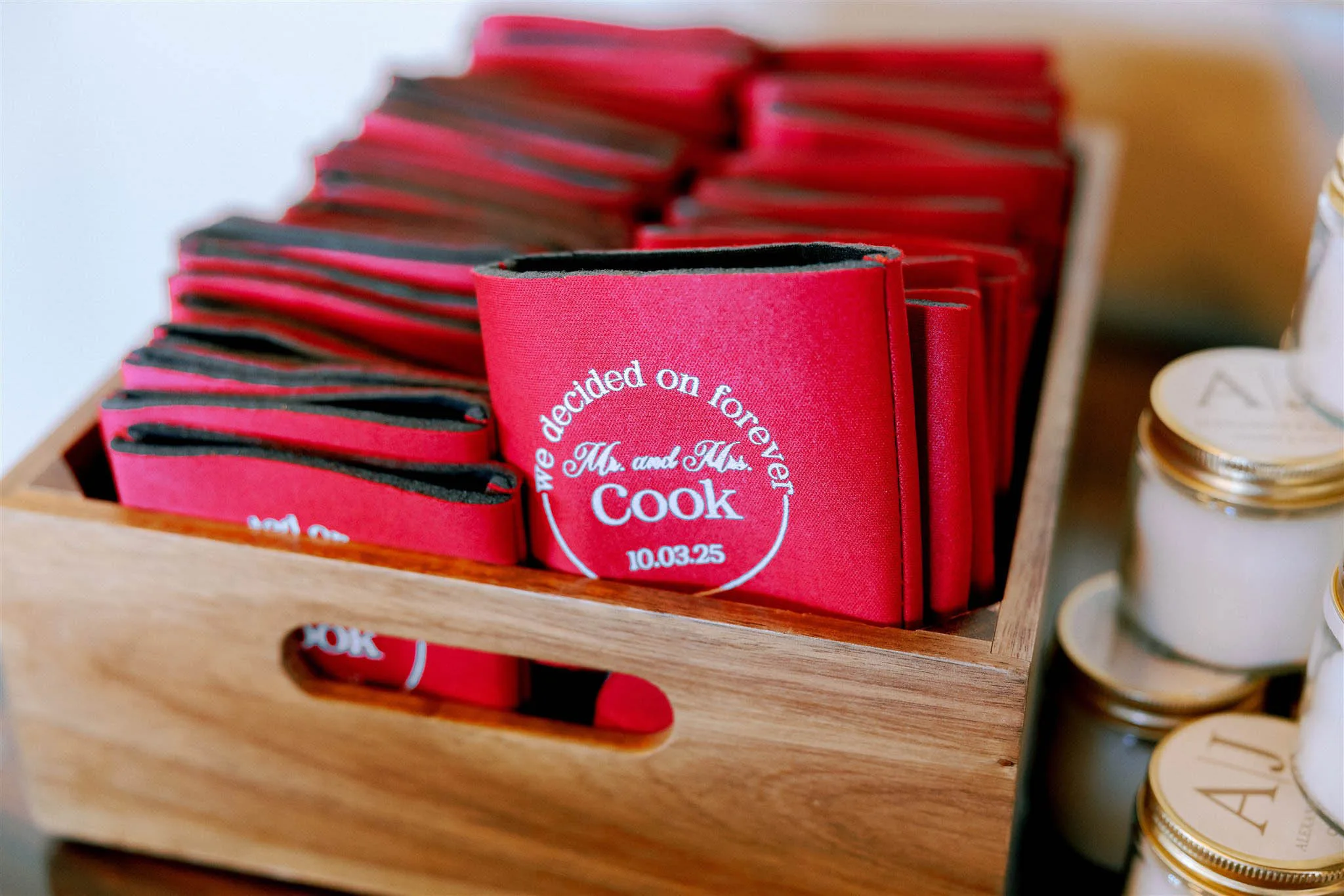 Red personalized wedding can coolers in a wooden crate reading "We decided on forever, Mr. and Mrs. Cook" by The Bride's Secretary