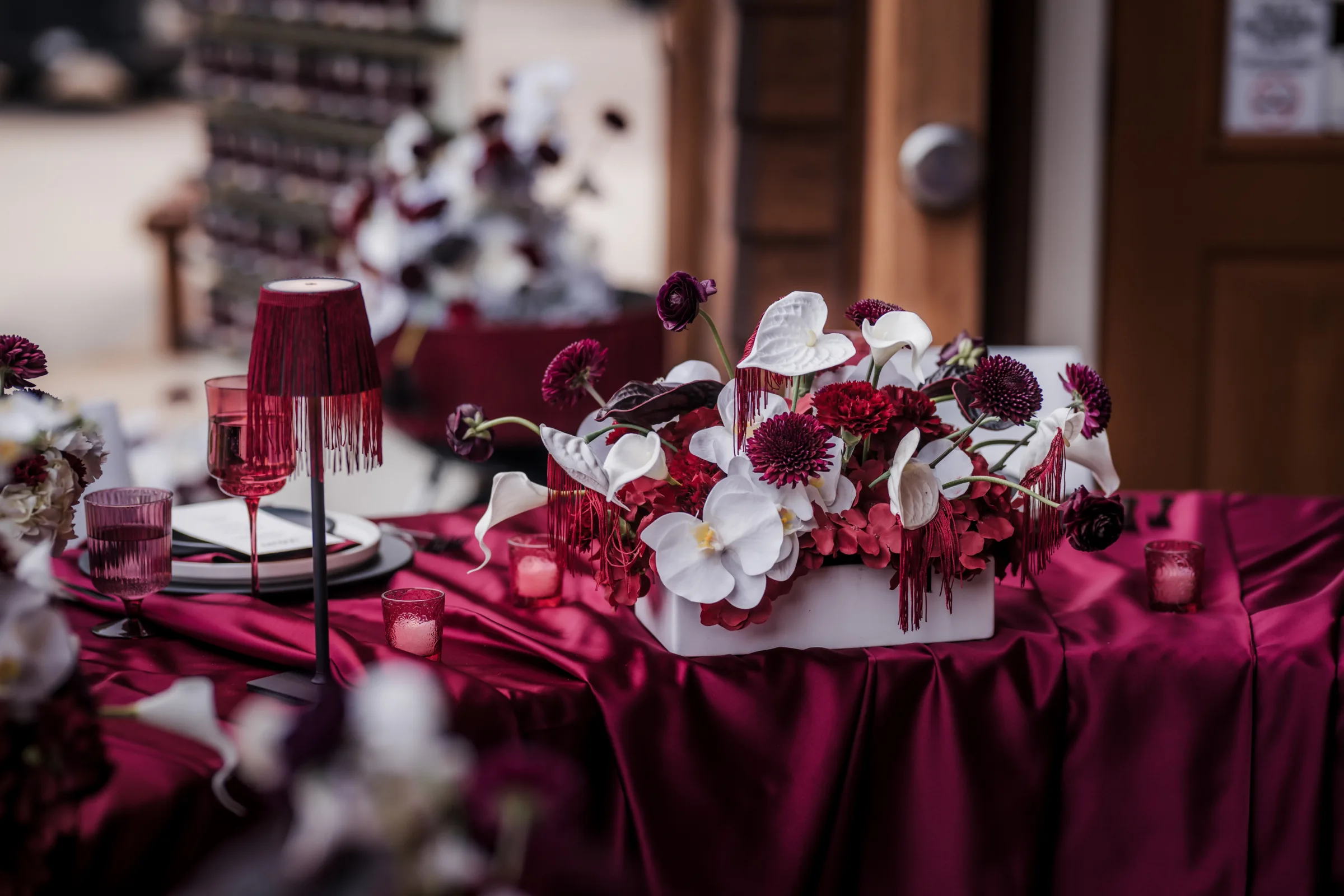 a detail of a modern cowboy wedding tablescape showing florals by Melody Rose Designs and rentals from Event Essentials