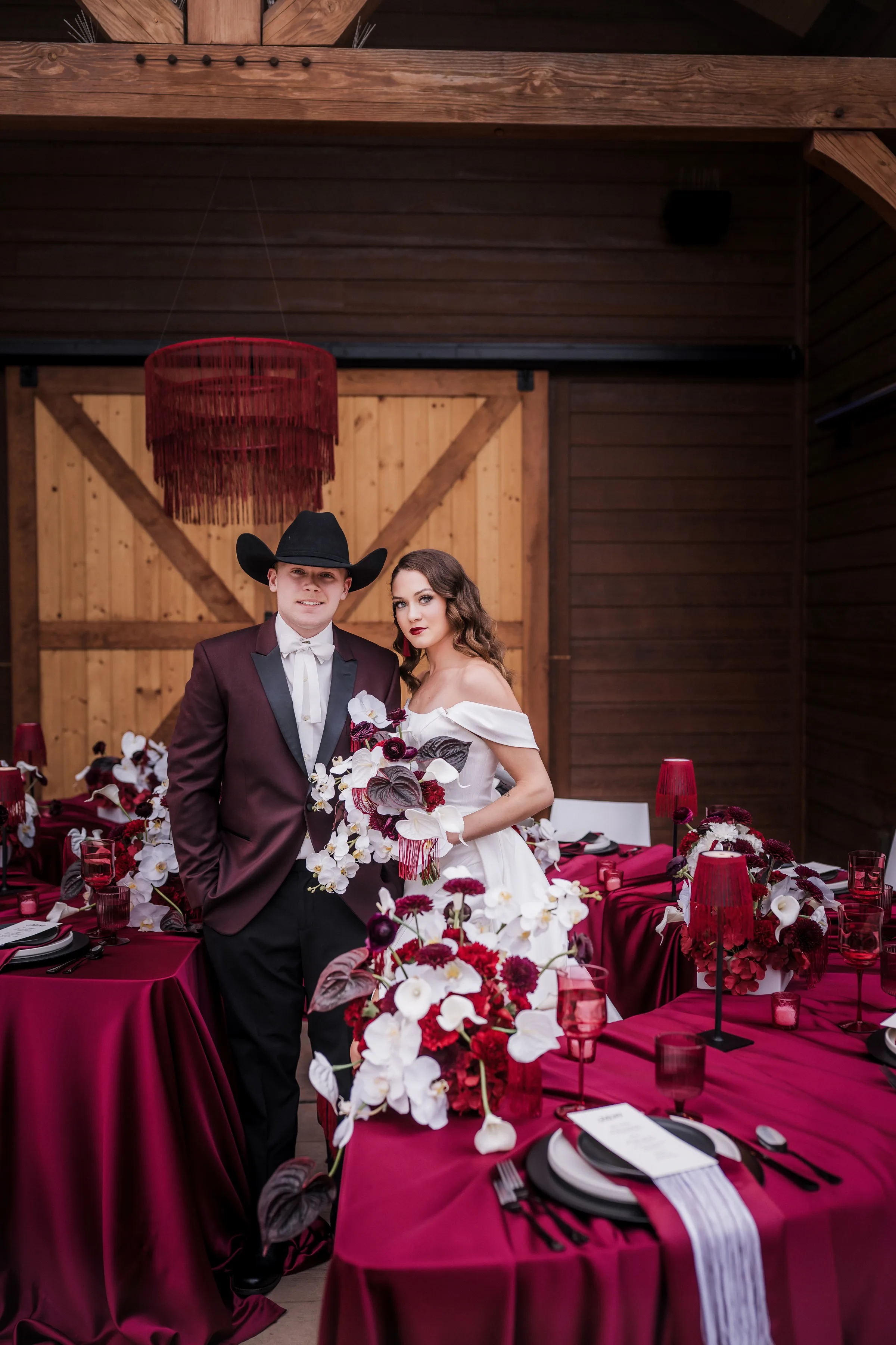 bride and groom models pose at a wedding reception space at Barnwood Events in Madison, Wisconsin