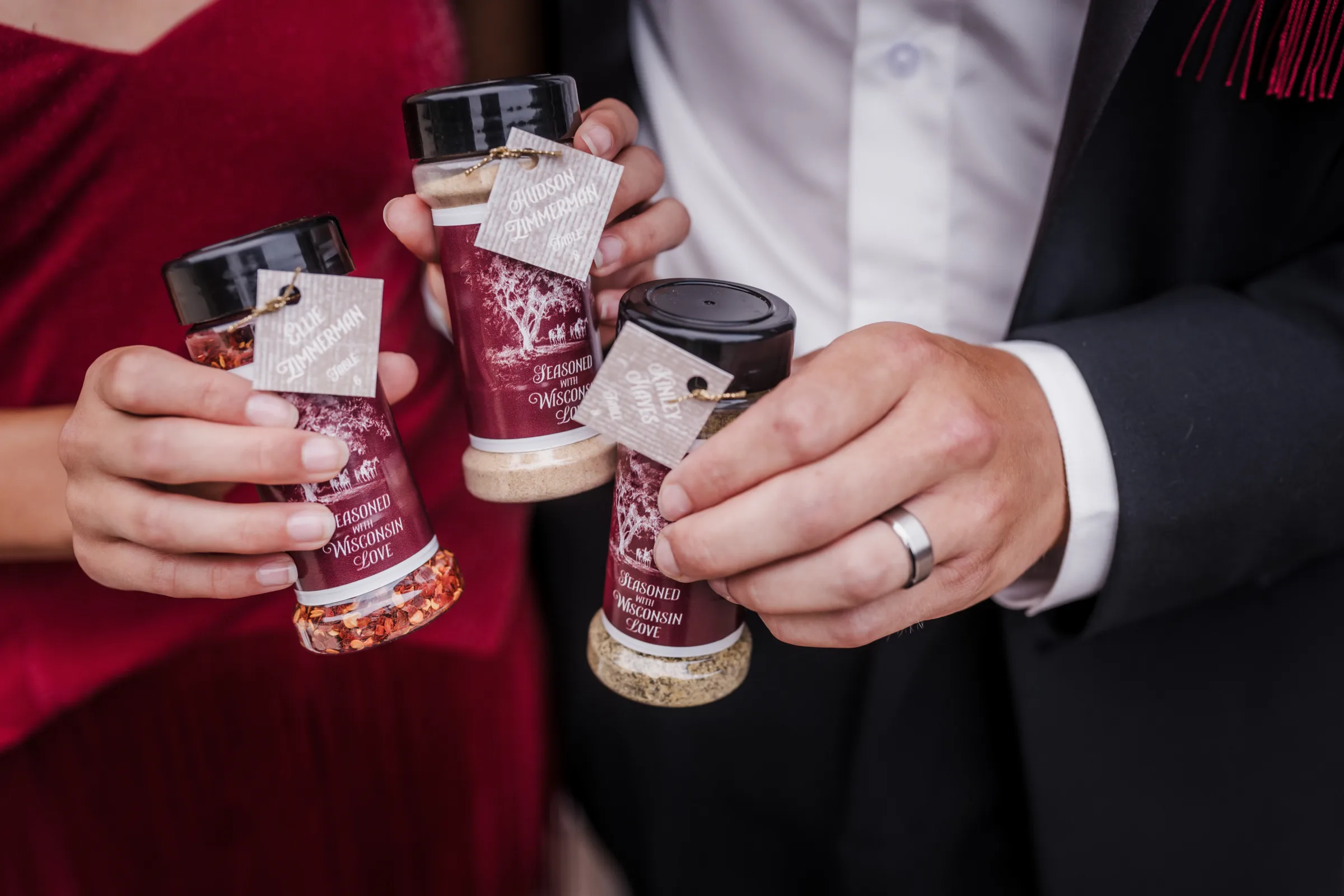 a detail photo of three spice jar wedding favors individually tagged by LK Bridal Studio
