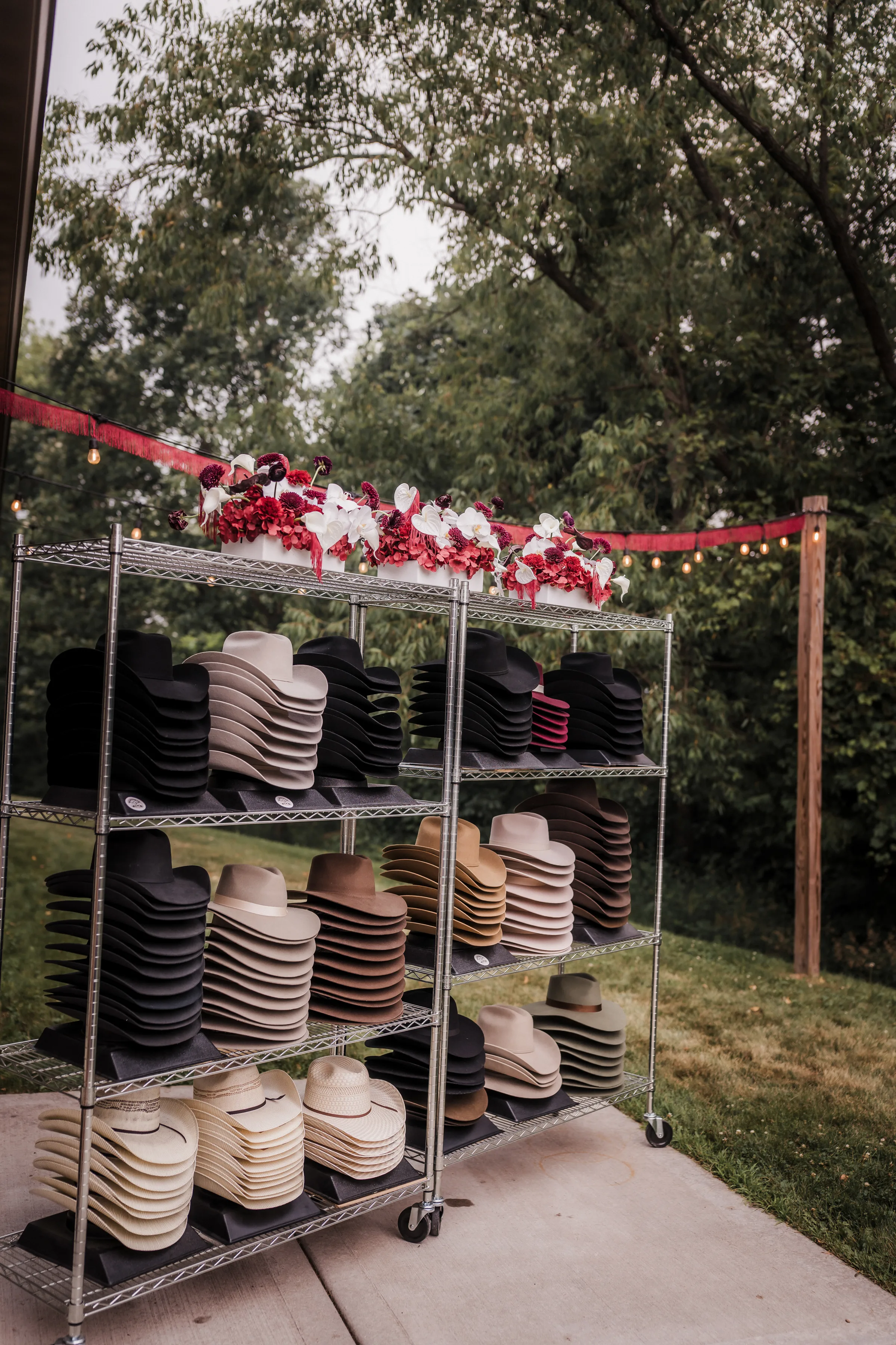 an angled photo showing stacks of cowboy hats available for customization from Hangman Hats