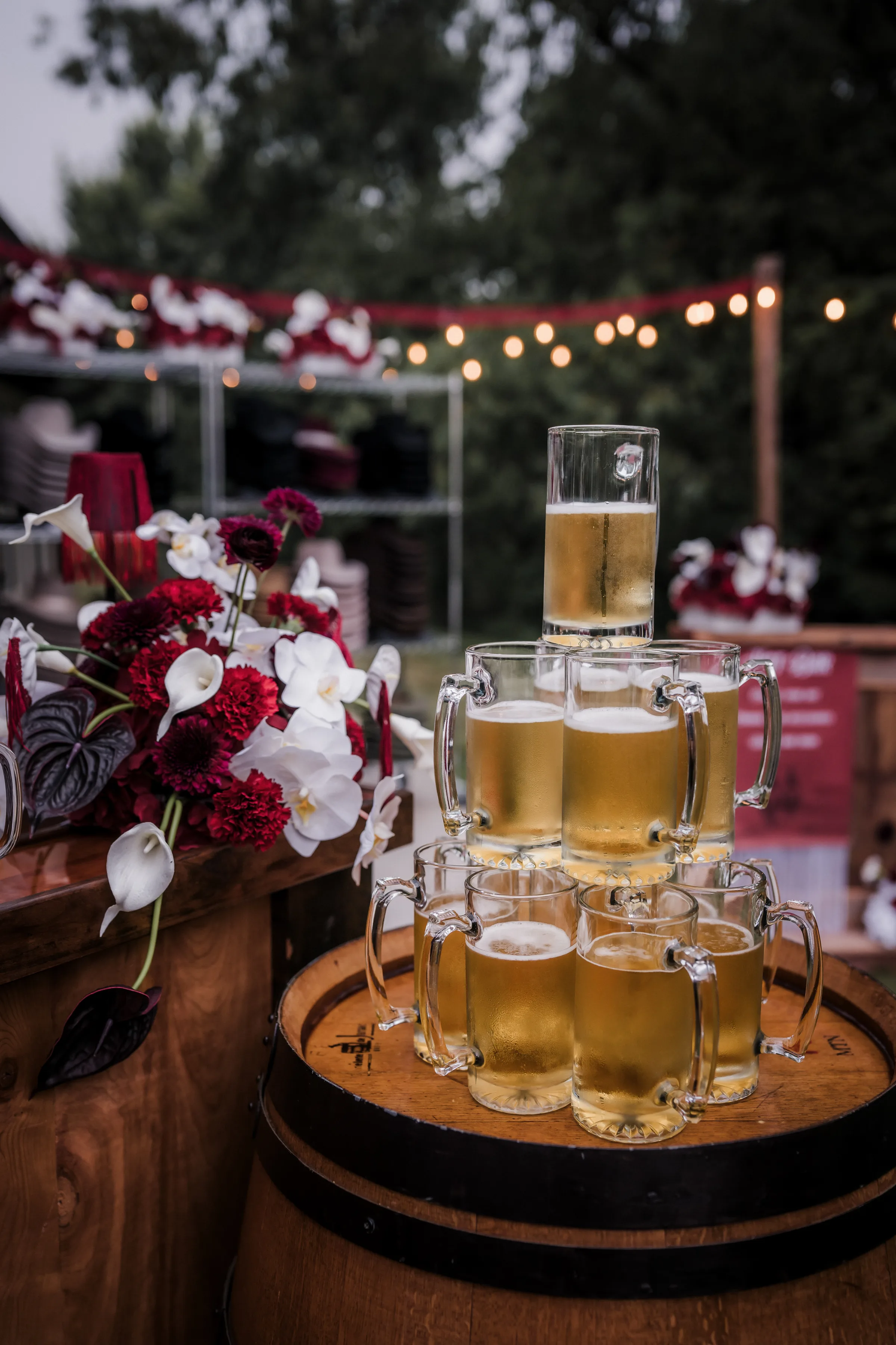 a beer tower bar offering from Barnwood Events, showing a towering stack of beer steins