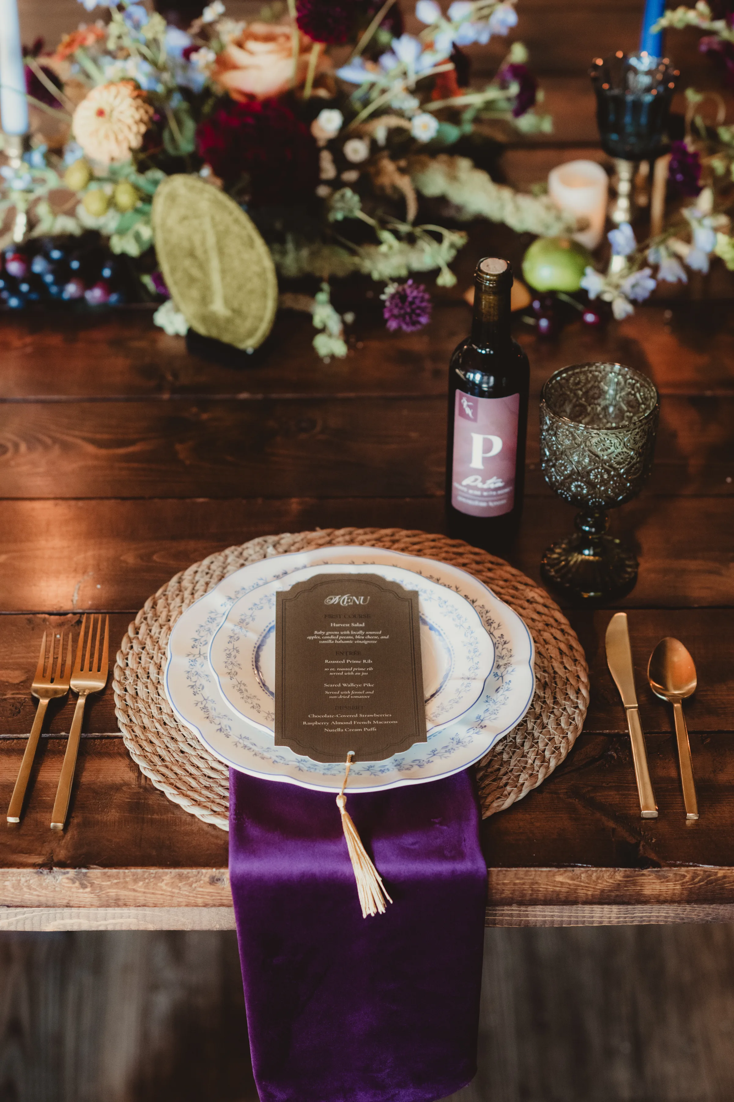 a contour cut menu from LK Bridal studio is layered at a place setting at the spiced garden party wedding inspiration tablescape