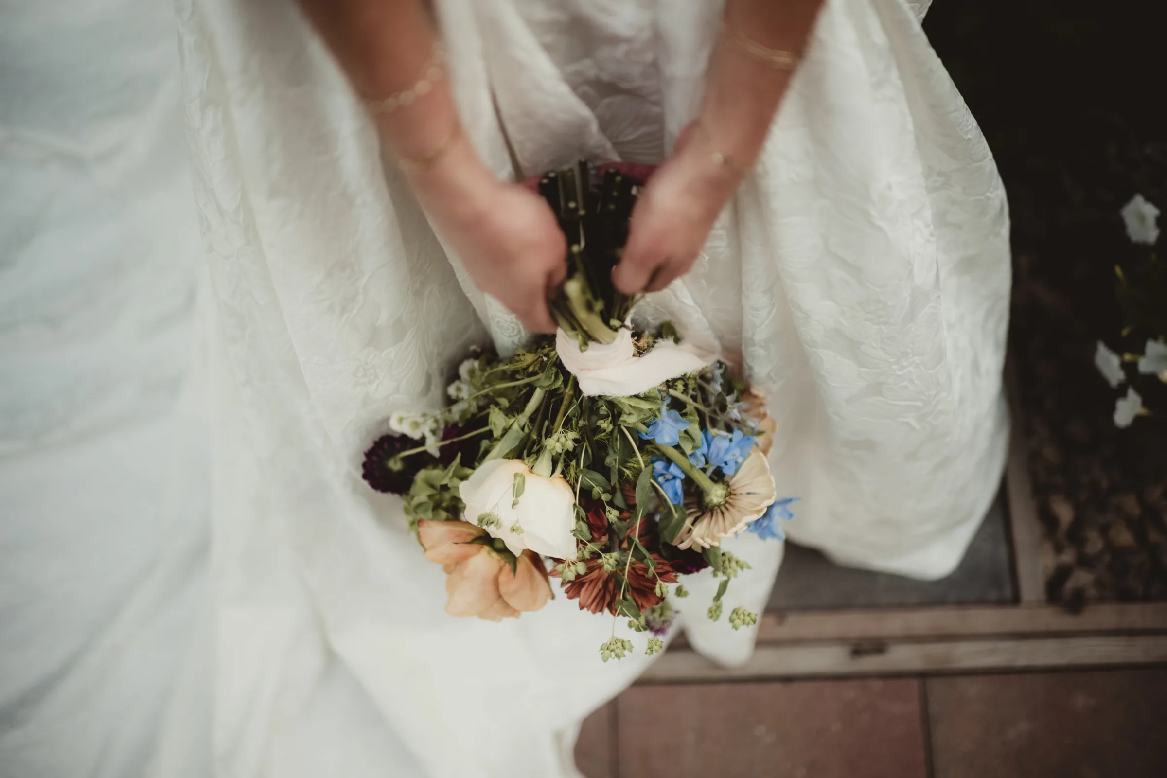 a above angle of the bride holding a bouquet