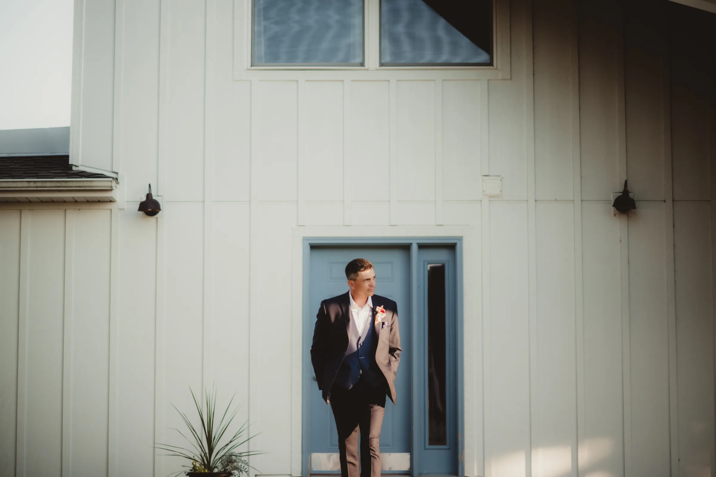 the groom model casually walks towards the camera