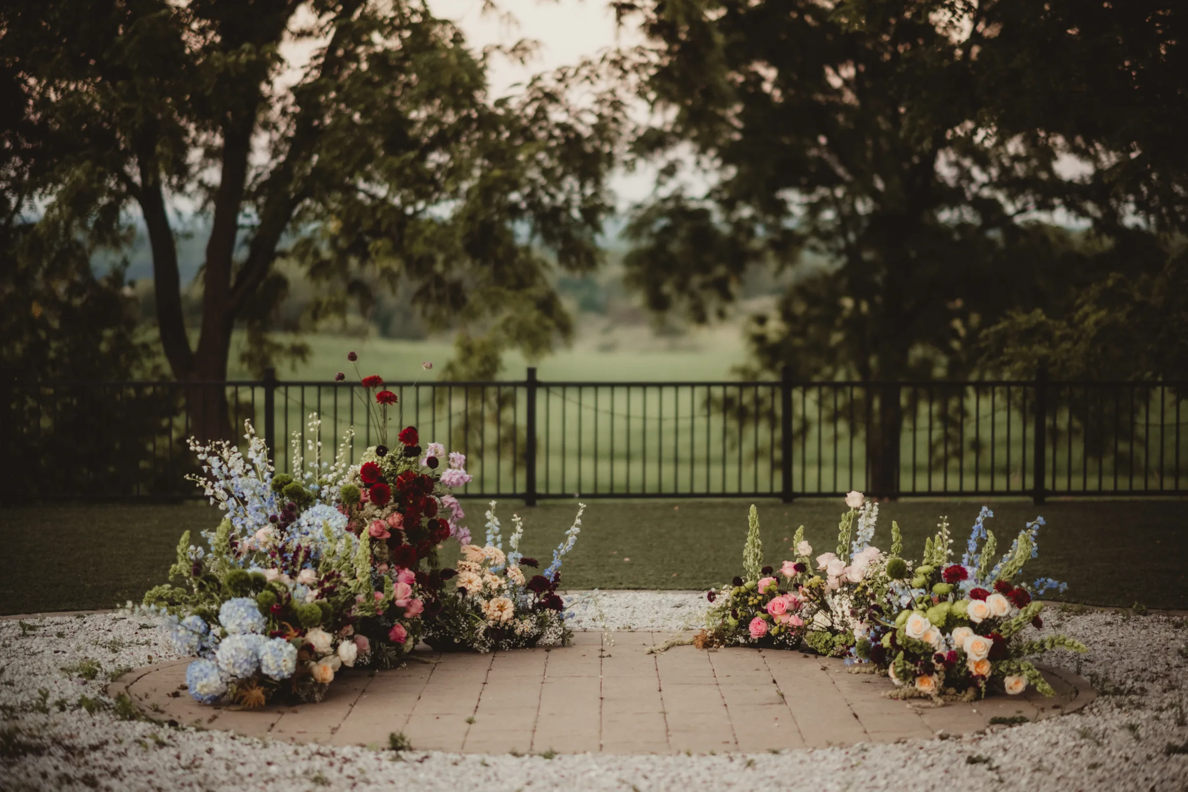 colorful, grounded floral arch wedding inspiration from Signature Events, featuring wildflower styling