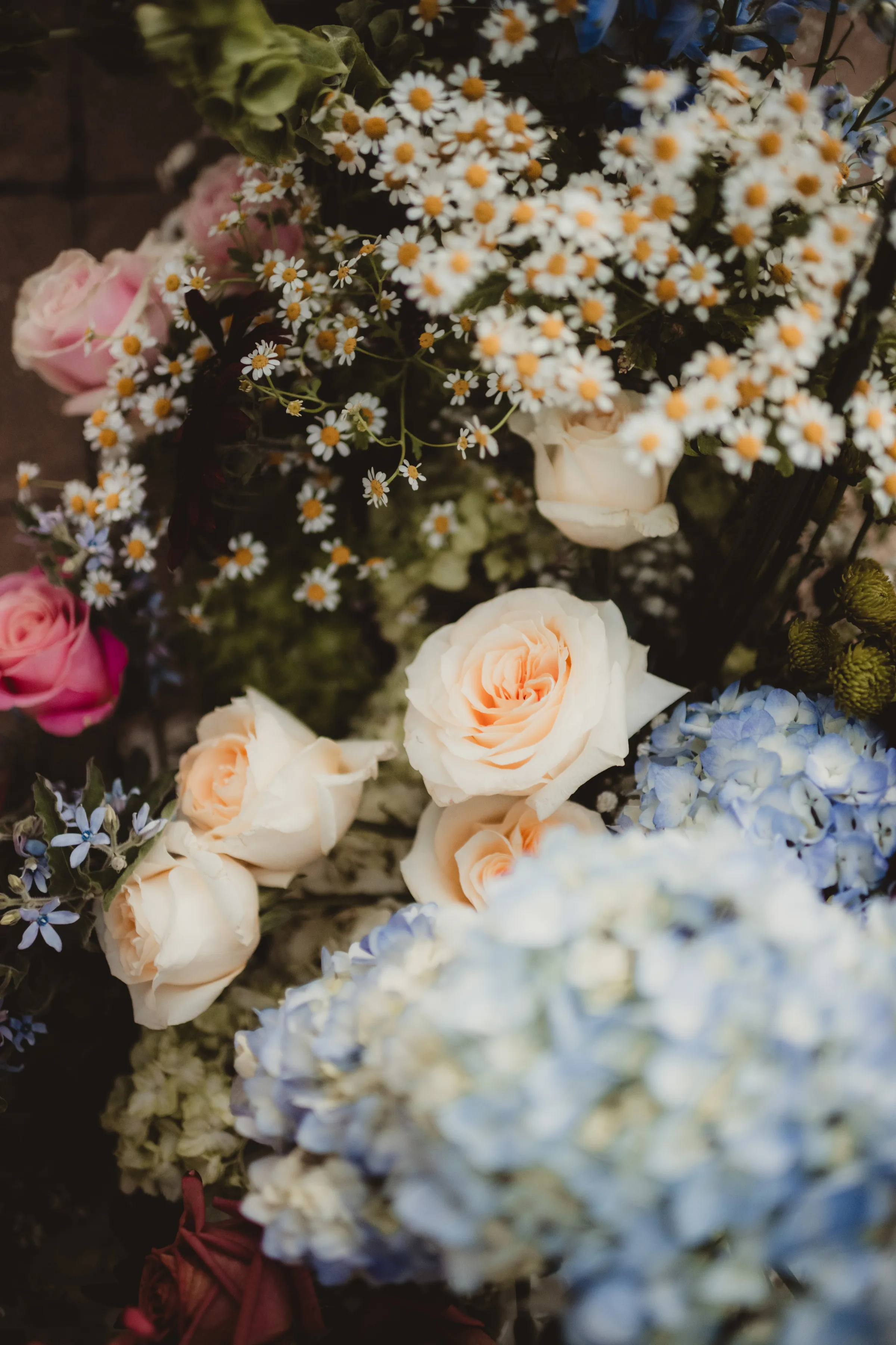 colorful, grounded floral arch wedding inspiration from Signature Events, featuring wildflower styling