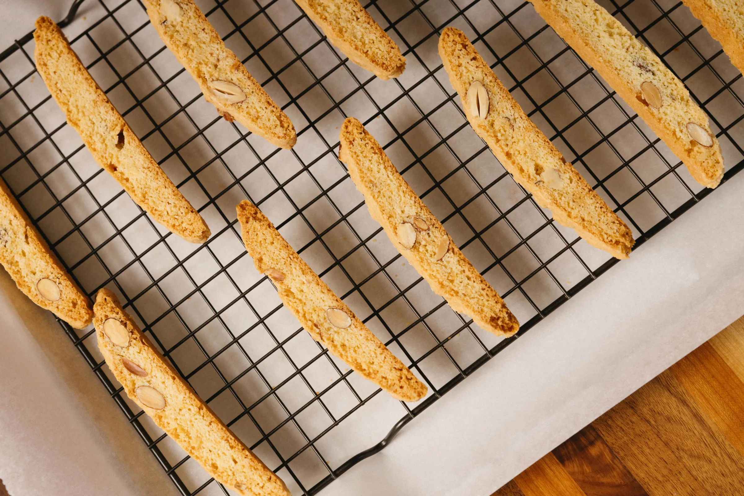 Amati Biscotti almond biscotti cooling on a wire rack fresh from the oven