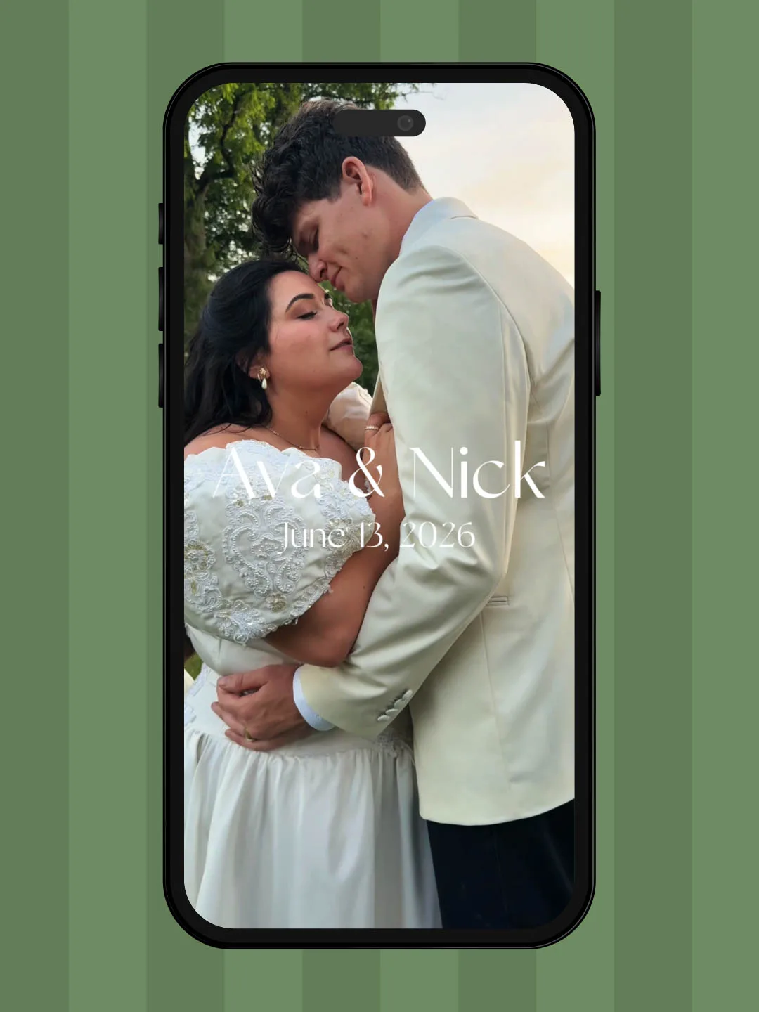iPhone picture of a bride in a white dress and a groom in a cream tuxedo jacket with black pants that says Ava & Nick June 13, 2026 made by Wi Do with Andrea