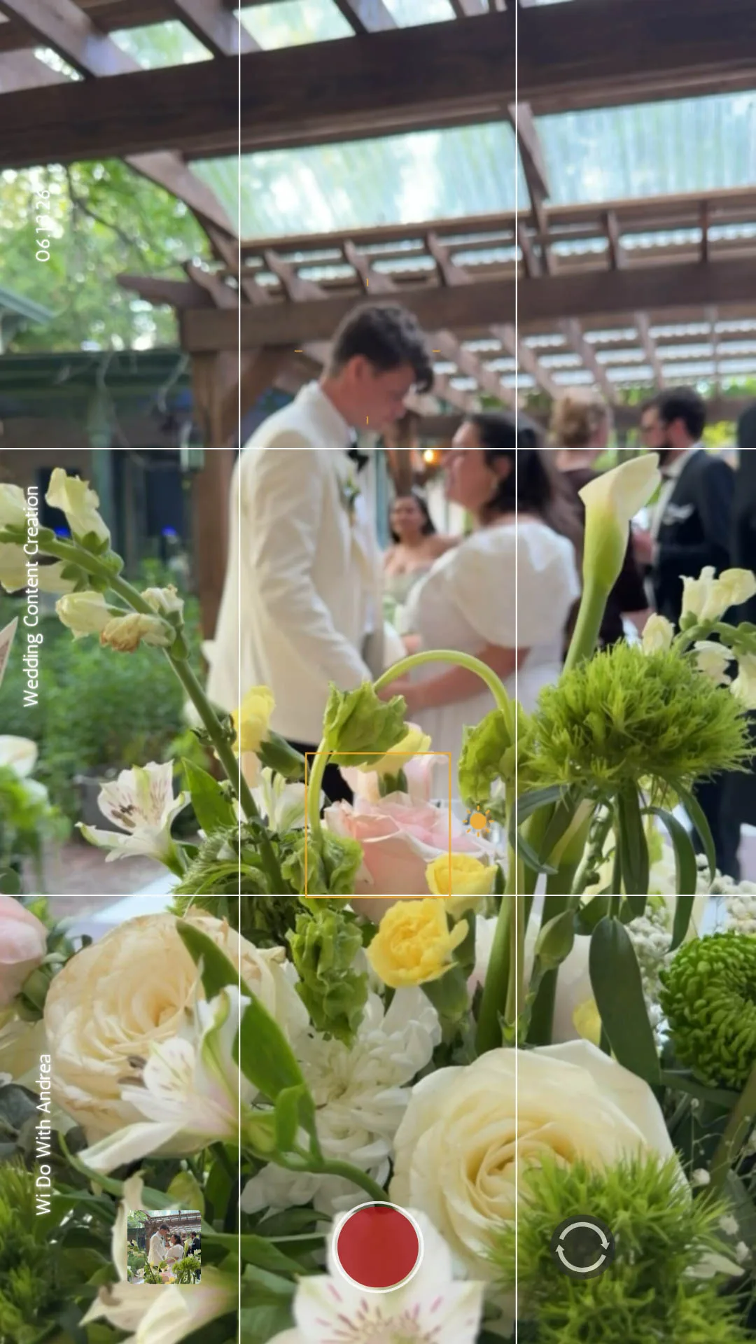 Video Frame Phone Camera Photo of A bride and groom dancing with white and green florals by Wi Do With Andrea in Madison, Wisconsin